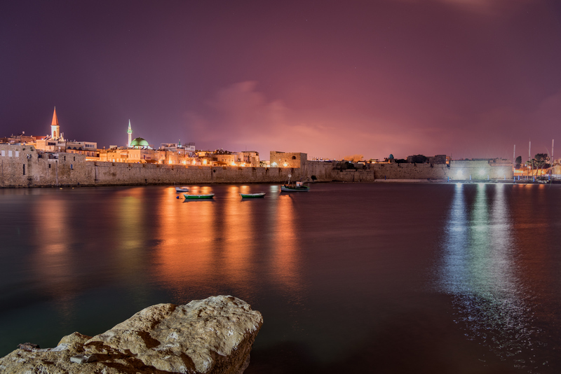 Acre's sea wall at night