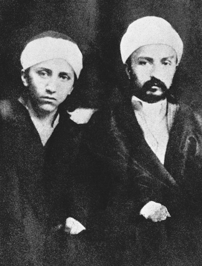 `Abdu'l-Bahá (right) with his brother Mírzá Mihdí, 1868